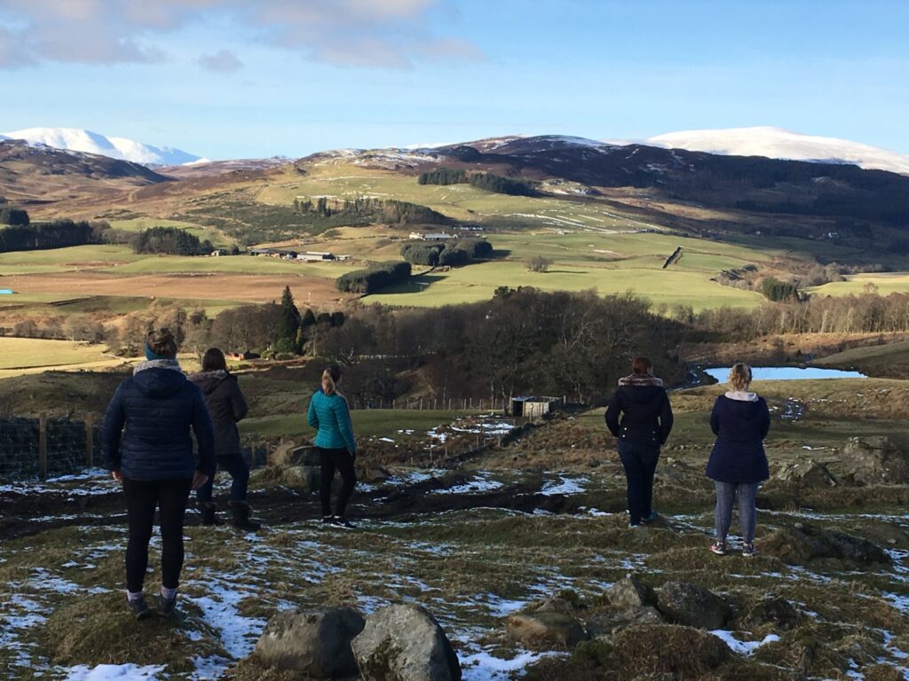 Guests enjoying enjoying countryside views on a peaceful winter getaway in Scotland