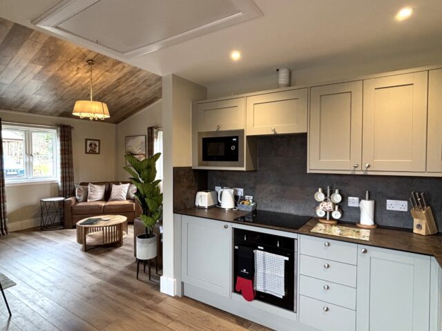 Azalea Lodge 1 Open Plan Kitchen leading to Lounge